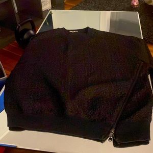 Black long sleeve sweatshirt with zipper in front